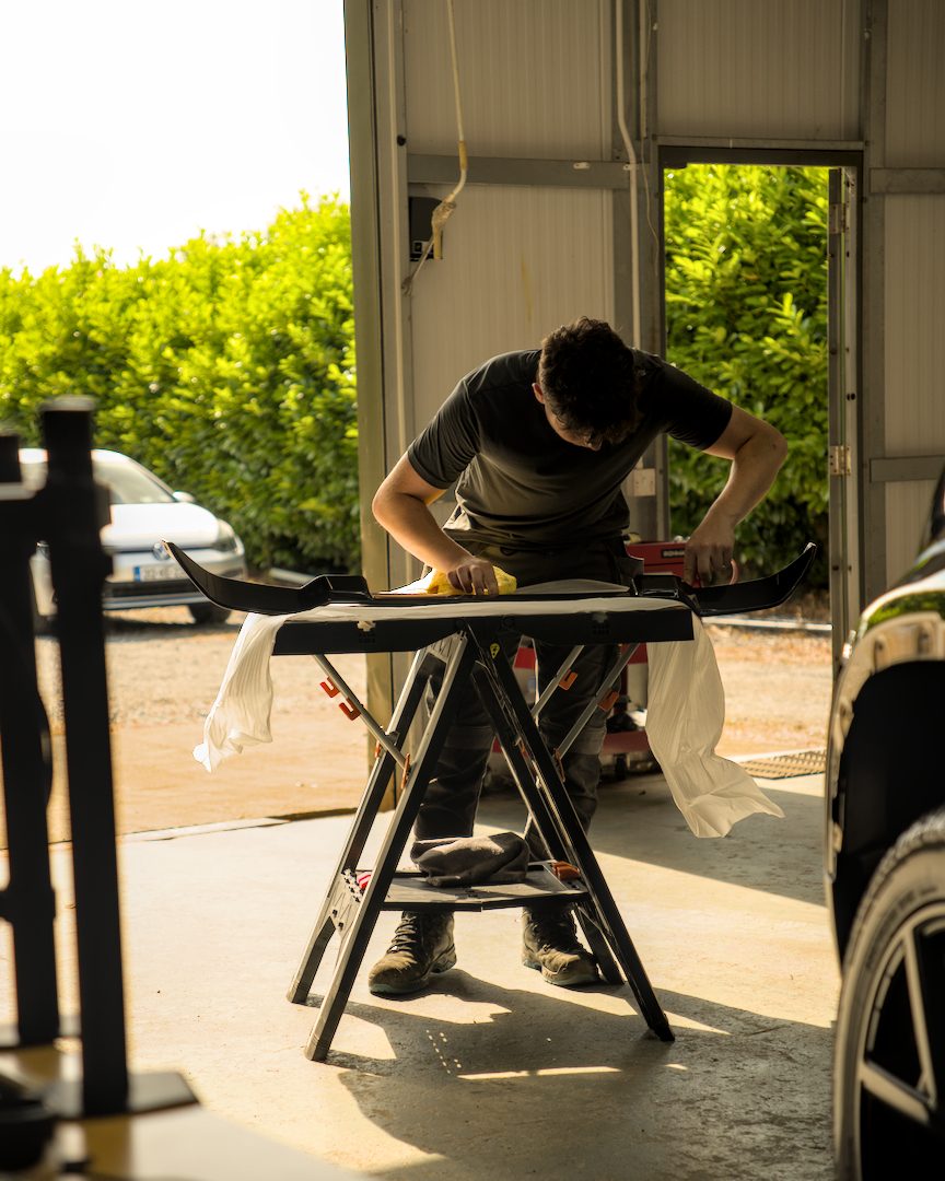 Prepping a spoiler before it goes on the car